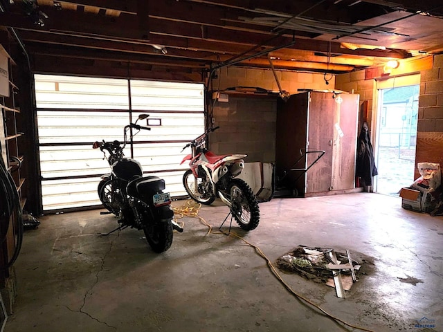 garage with concrete block wall