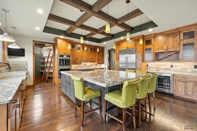 kitchen with wine cooler, brown cabinets, dark wood finished floors, stainless steel appliances, and coffered ceiling