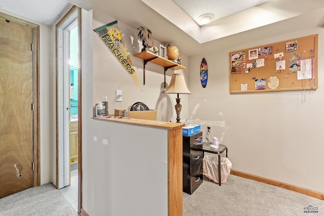 bar with carpet floors and baseboards