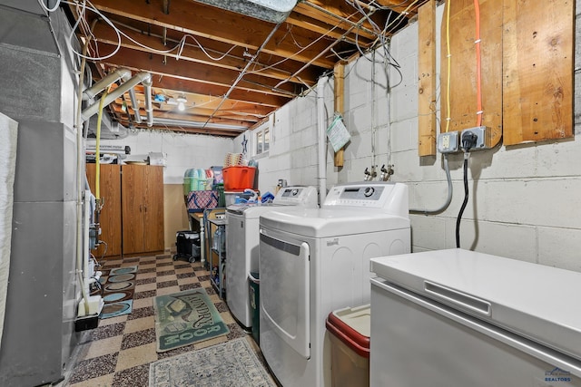 laundry area featuring laundry area, washer and dryer, and tile patterned floors