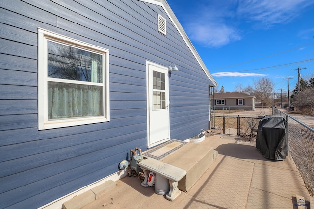 view of patio / terrace featuring fence