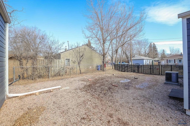 view of yard with fence private yard and cooling unit