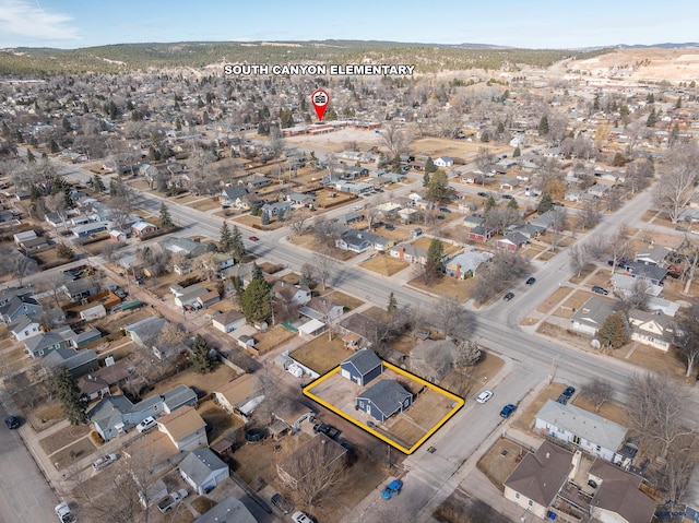 birds eye view of property with a residential view