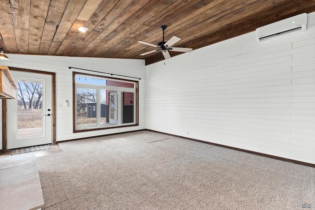 spare room featuring vaulted ceiling, carpet floors, a wall unit AC, and wood ceiling