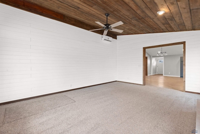 carpeted empty room with a wall mounted AC, wood ceiling, vaulted ceiling, baseboards, and ceiling fan with notable chandelier