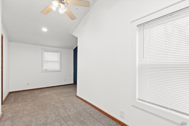 empty room featuring carpet flooring, ceiling fan, and baseboards