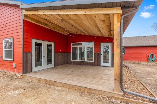 exterior space featuring a wooden deck and french doors