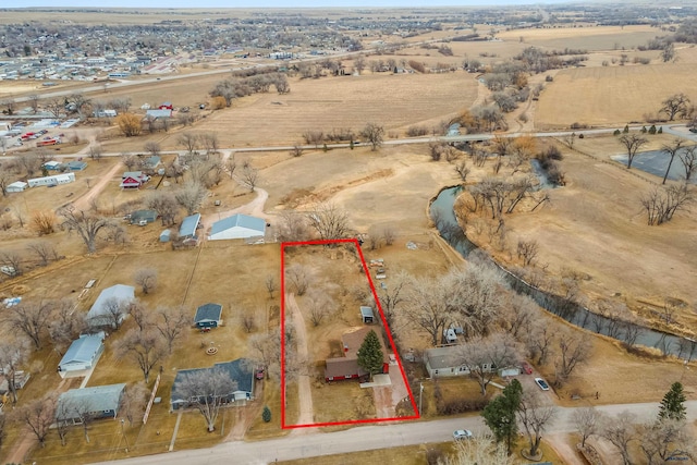 birds eye view of property featuring a rural view