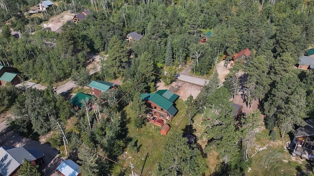 bird's eye view featuring a wooded view