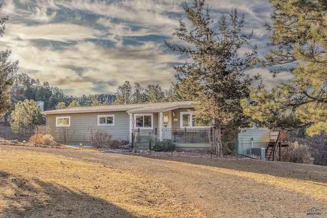 ranch-style home featuring covered porch