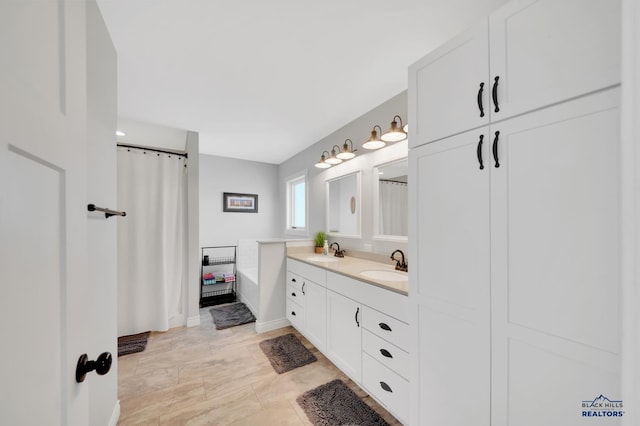 bathroom with double vanity and a sink