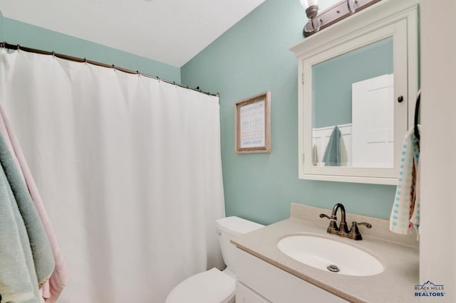 full bathroom featuring toilet and vanity