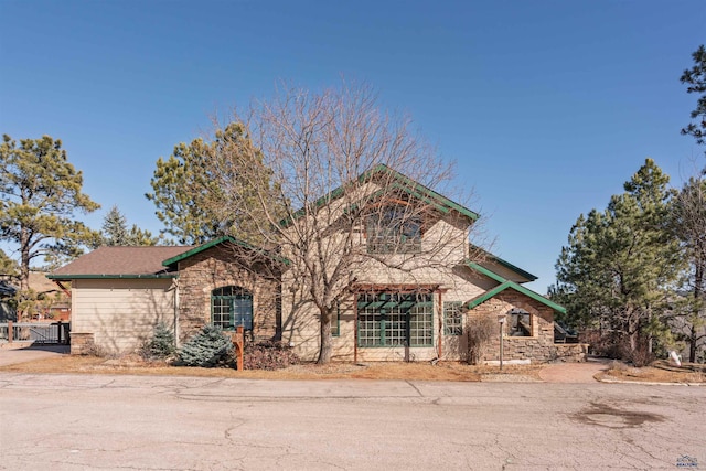 view of front facade featuring stone siding