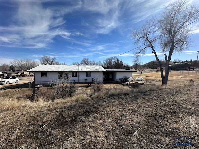 back of property with metal roof