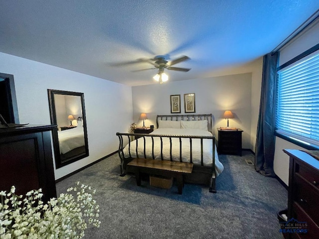 bedroom with ceiling fan, a textured ceiling, carpet, and baseboards