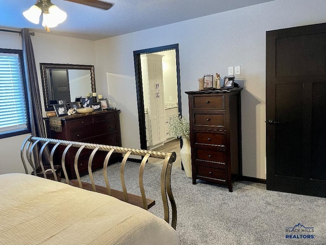 bedroom with light carpet and ceiling fan