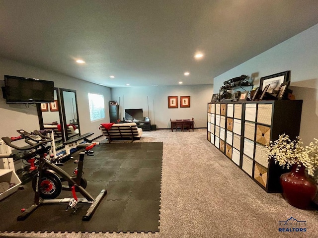 workout area featuring carpet and recessed lighting