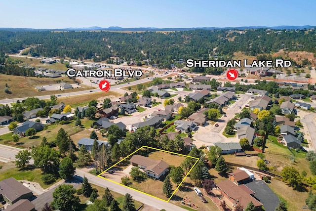 aerial view featuring a residential view and a forest view