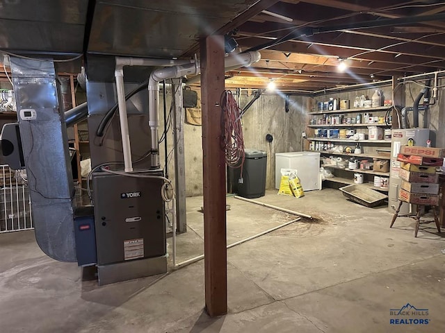 1001 E St, Edgemont, SD 57735 - unfinished below grade area with fridge and water heater