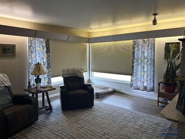 1001 E St, Edgemont, SD 57735 - sitting room with wood finished floors and baseboards