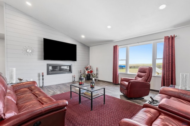 14113 Treasure Coach Rd, Piedmont, SD 57769 - living area featuring recessed lighting, lofted ceiling, wood finished floors, and a glass covered fireplace