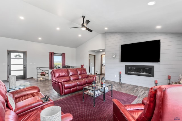 14113 Treasure Coach Rd, Piedmont, SD 57769 - living room featuring vaulted ceiling, a ceiling fan, wood finished floors, a large fireplace, and recessed lighting