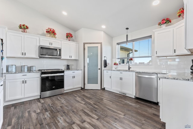 14113 Treasure Coach Rd, Piedmont, SD 57769 - kitchen with a sink, lofted ceiling, white cabinets, and appliances with stainless steel finishes