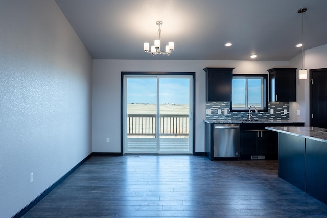 kitchen with tasteful backsplash, dark wood-type flooring, plenty of natural light, and stainless steel dishwasher