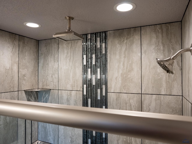 room details with a textured ceiling, walk in shower, and recessed lighting