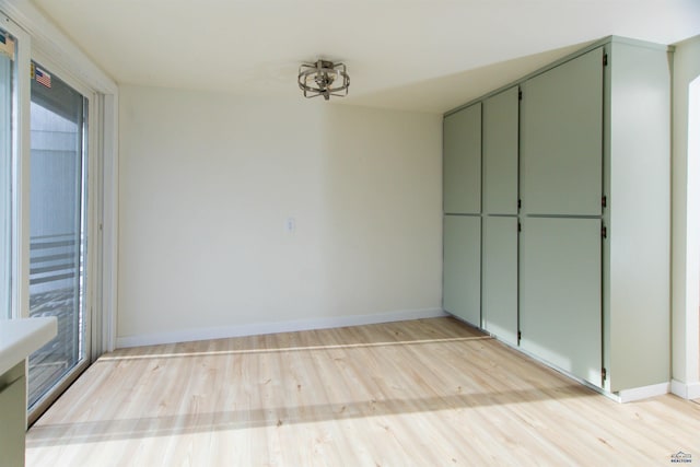 interior space featuring light wood-style floors and baseboards