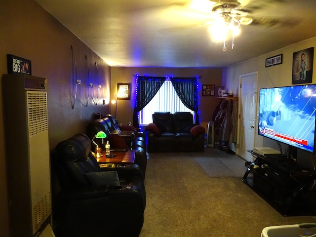 living area with carpet and ceiling fan