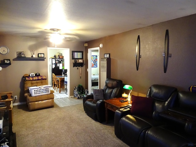 living room with carpet floors and a ceiling fan