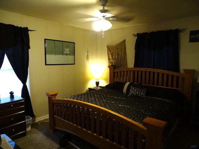 carpeted bedroom featuring ceiling fan and baseboards