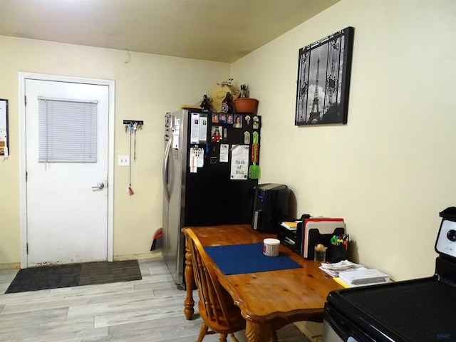 dining area featuring light wood-style floors