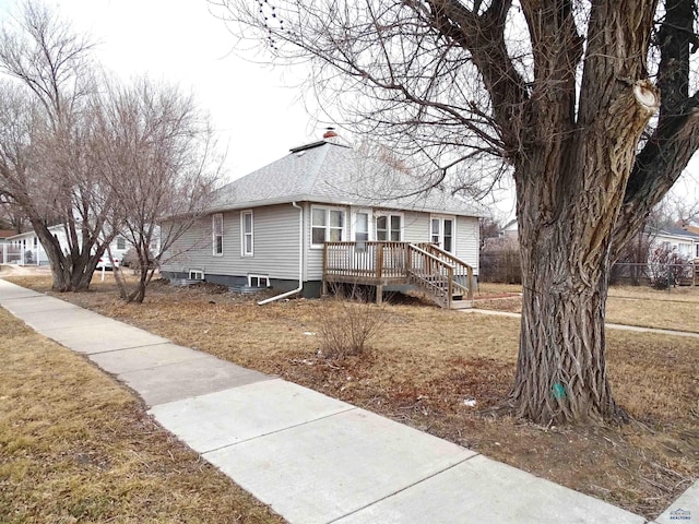 view of front of home featuring roof with shingles