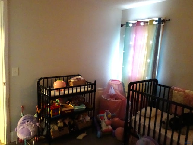 bedroom with a nursery area