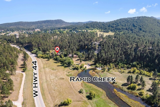 bird's eye view featuring a mountain view and a view of trees