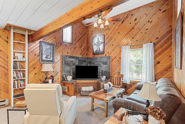 carpeted living room with ceiling fan, wooden walls, visible vents, and beamed ceiling