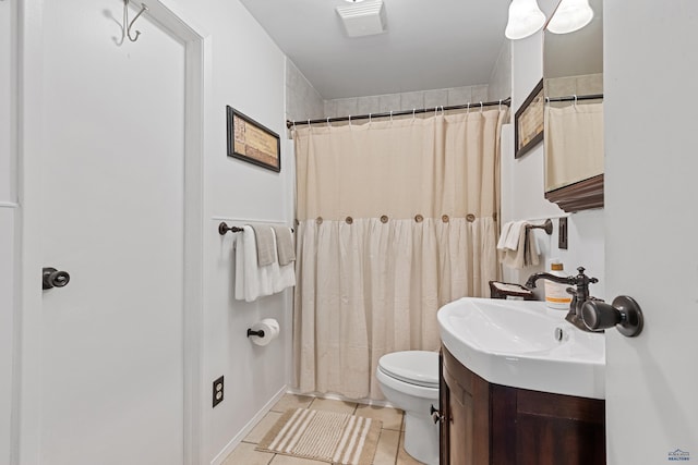 full bathroom with tile patterned flooring, a shower with shower curtain, vanity, and toilet