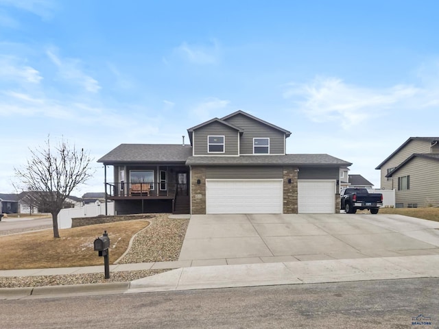 view of front of property with a garage, concrete driveway, and roof with shingles