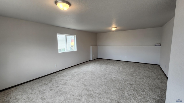 424 Yelner Dr Lot 38Blk 4, Box Elder, SD 57719 - empty room featuring carpet flooring, a textured ceiling, and baseboards