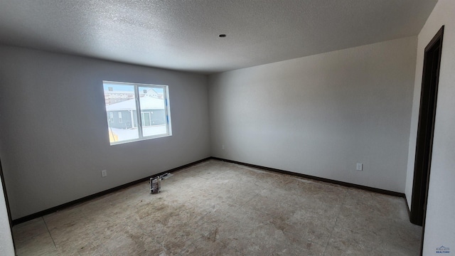 424 Yelner Dr Lot 38Blk 4, Box Elder, SD 57719 - empty room with baseboards and a textured ceiling