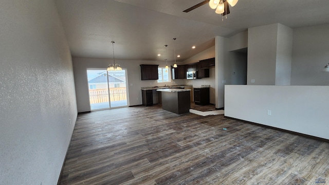 424 Yelner Dr Lot 38Blk 4, Box Elder, SD 57719 - kitchen with stainless steel microwave, dark wood-type flooring, open floor plan, a center island, and dark brown cabinets