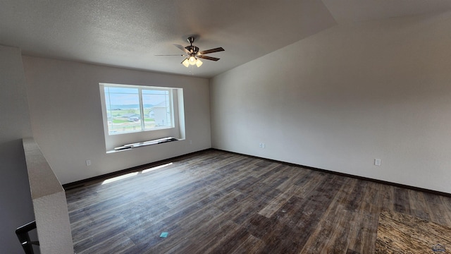 424 Yelner Dr Lot 38Blk 4, Box Elder, SD 57719 - unfurnished room with dark wood finished floors, a ceiling fan, and baseboards