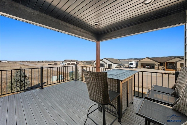 wooden deck with a residential view