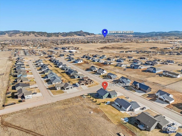 birds eye view of property featuring a mountain view and a residential view