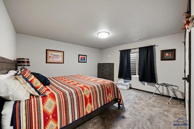 bedroom with carpet flooring, visible vents, and baseboards