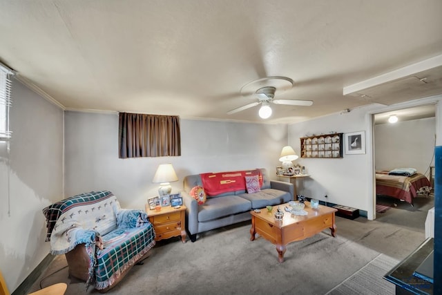 living area with baseboards and a ceiling fan