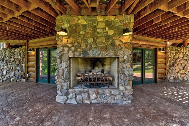 exterior space with an outdoor stone fireplace