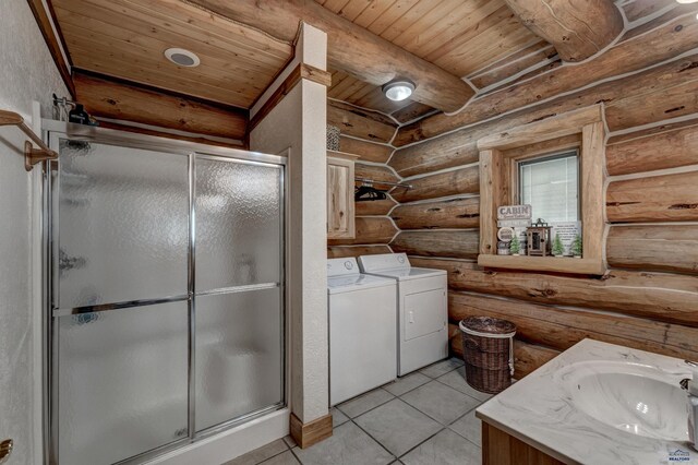 bathroom featuring tile patterned floors, independent washer and dryer, a stall shower, rustic walls, and wooden ceiling